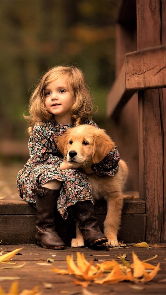 Little Girl With Golden Retriever Puppy Wallpaper