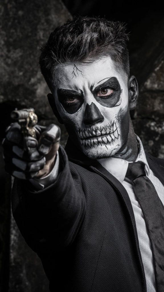 Skull Face Guy Shooting Dark Wallpaper